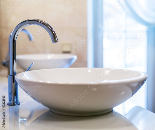 Closeup of water-supply faucet in modern bathroom