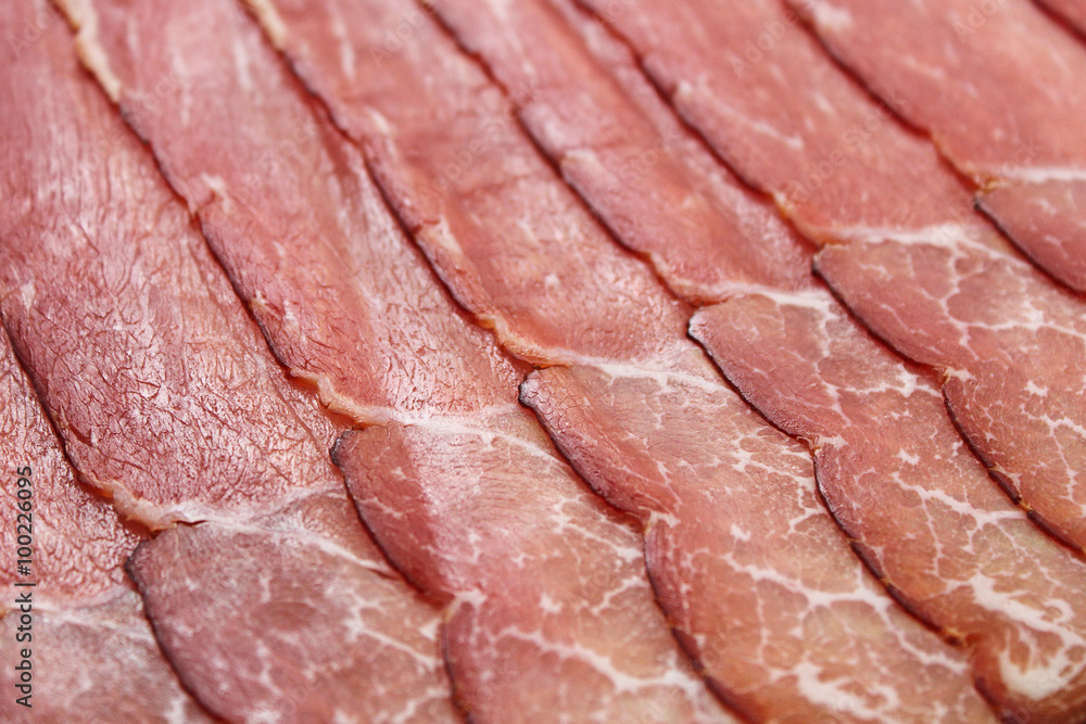 Slices of prosciutto ham. Background. Shallow depth of field. Slices of prosciutto ham. Background. Shallow depth of field.