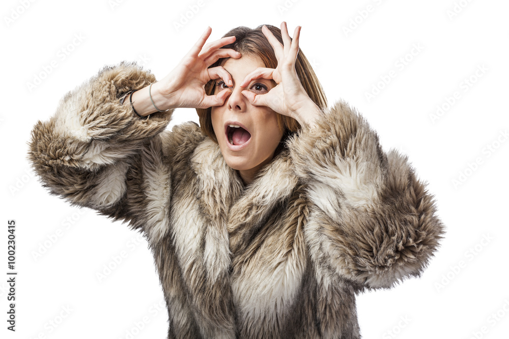 beautiful young woman looking through her fingers beautiful young woman looking through her fingers
