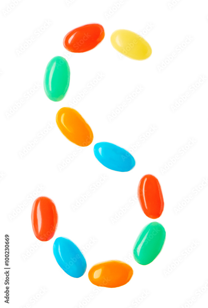 S letter made of multicolored candies isolated on white