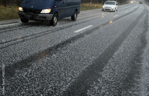 Hailstorm on the road in a summer day 