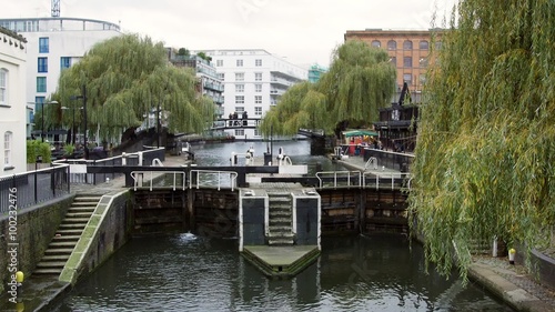 View of the double lock on the canal at the entrance of the famous lock market in Camden Town, London photo