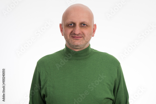 Portrait of a pensive young bald man