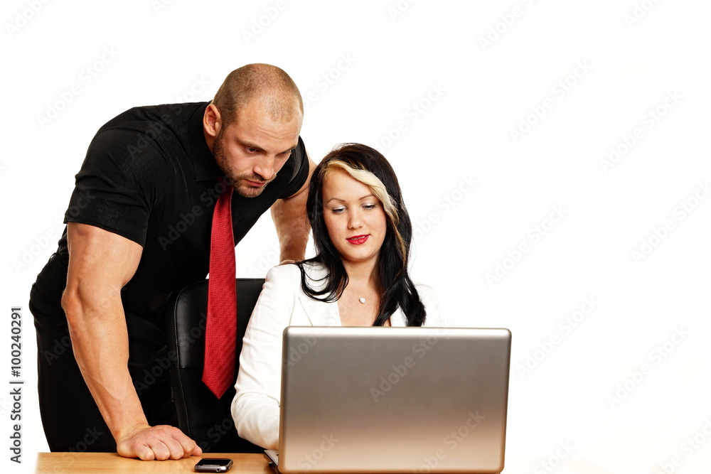 Businessman in black shirt and businesswoman working something on the computer Businessman in black shirt and businesswoman working something on the computer