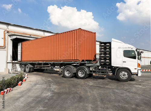 Container truck loading goods at warehouse