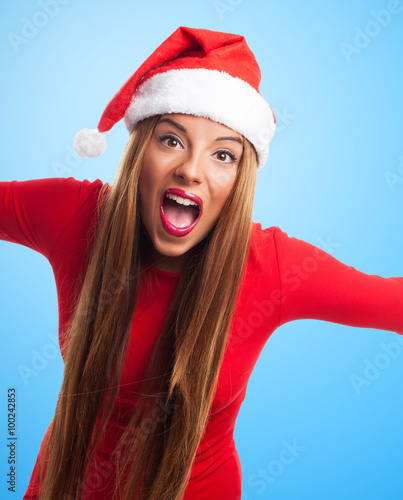 portrait of a beautiful young woman shouting at Christmas