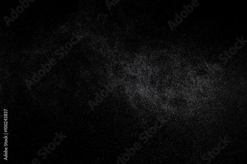 Abstract splashes and drops of water on black background.