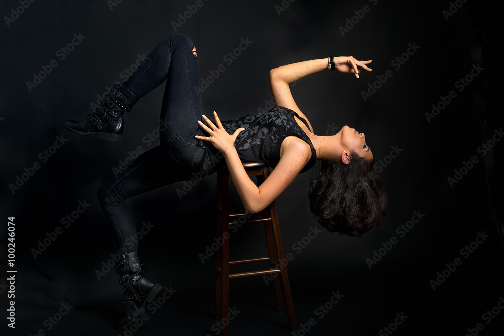 Sensual woman laying back on her chair