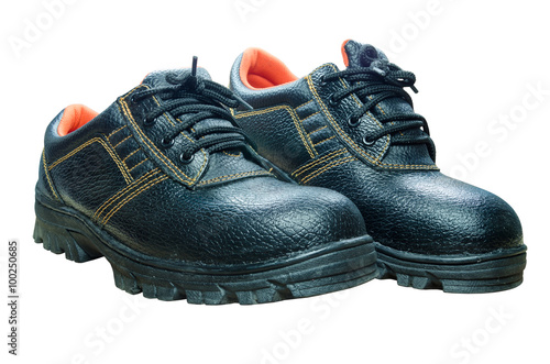 Black steel toe safety boots on white background.