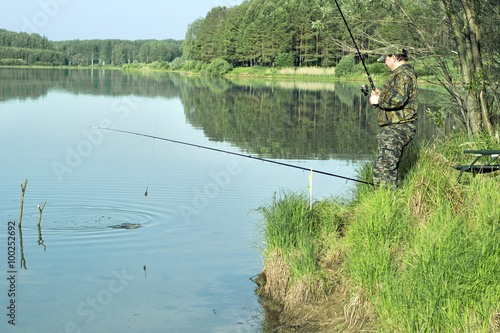 The fisherman pulls the fish ashore