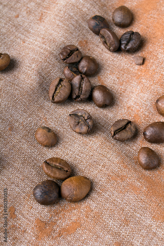 Coffee beans on fabric background Coffee beans on fabric background