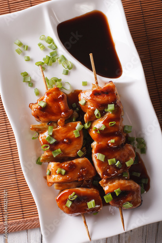 Japanese chicken yakitori on skewers close-up. vertical top view
