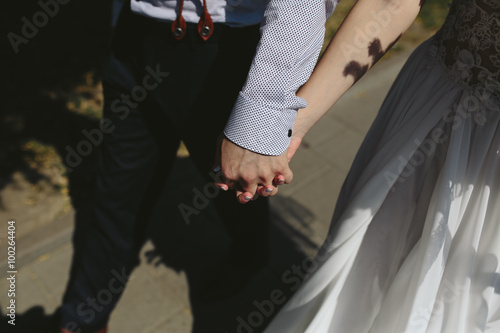 bride and groom walking around the city