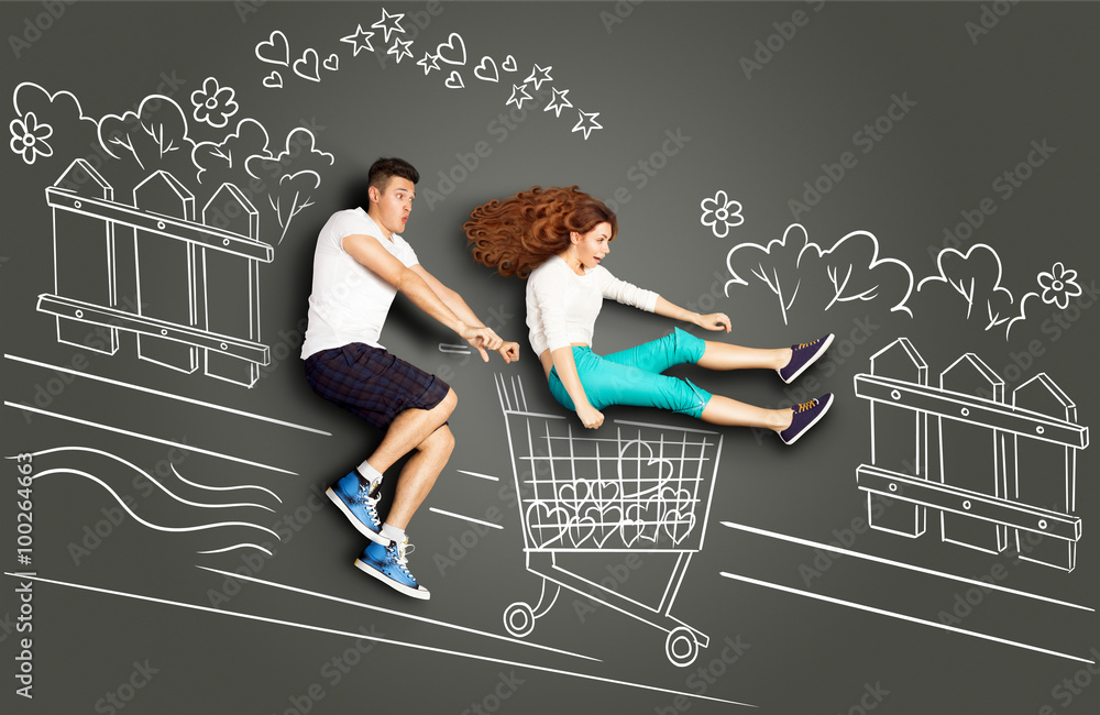 Happy valentines love story concept of a romantic couple on chalk drawings  background. Male riding his girlfriend in a shopping Stock Photo - Alamy