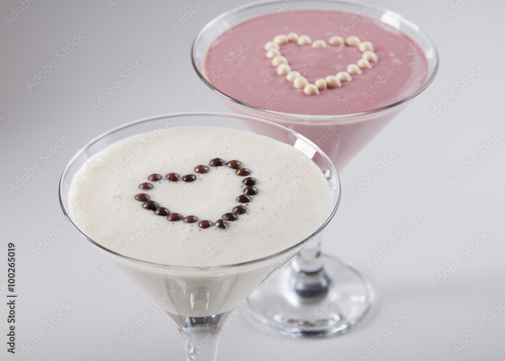 Banana smoothie and raspberry smoothie . Banana smoothie and raspberry smoothie .