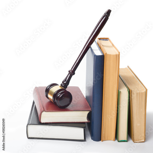 Fotografia, Obraz Law book with a wooden judges gavel on table in courtroom