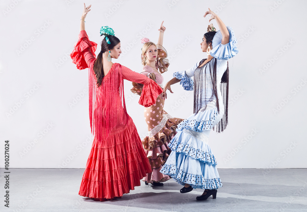 Fototapeta premium Pretty three young flamenco dancer in beautiful dress.