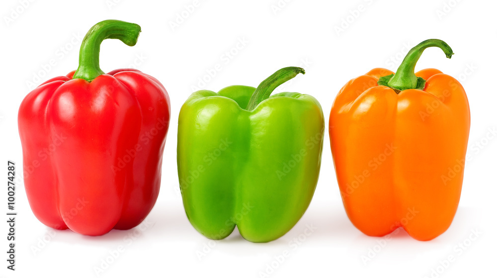 red, green and orange bell peppers on a white background red, green and orange bell peppers on a white background