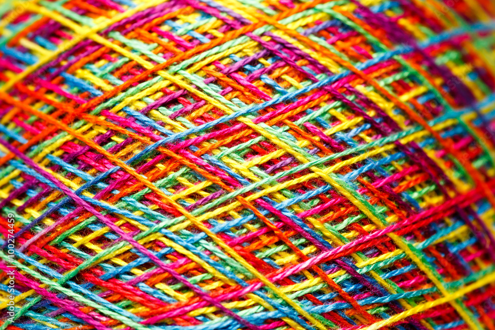 Sewing threads as a multicolored background close up