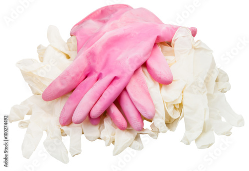 pair ofused pink protective gloves on new gloves photo