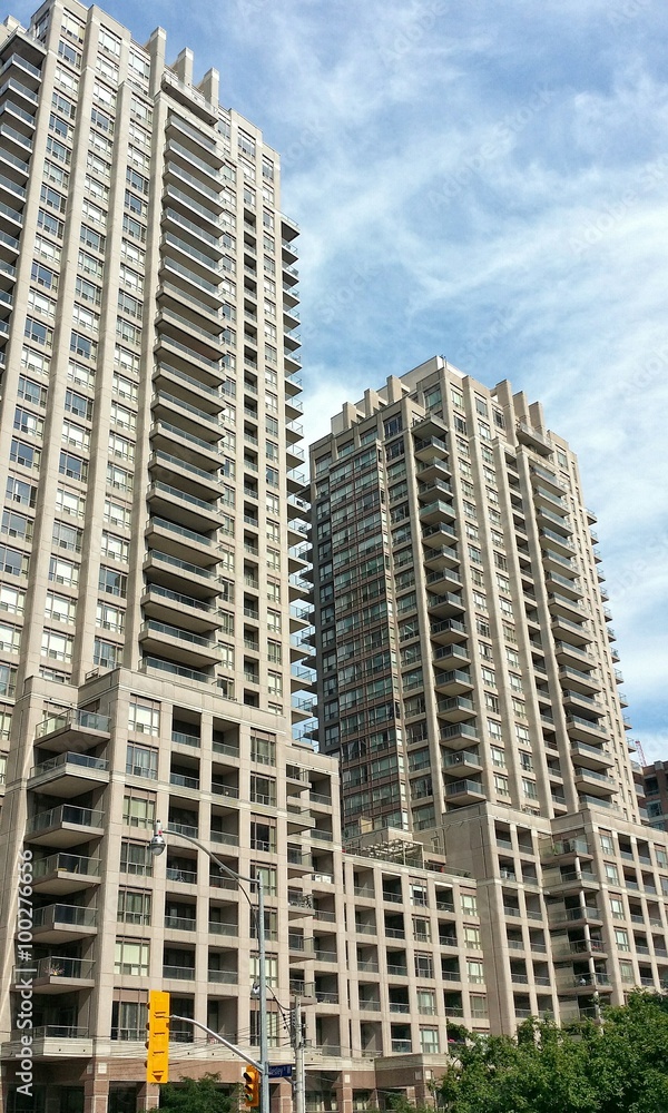 Modern highrise buildings with blue sky in background
