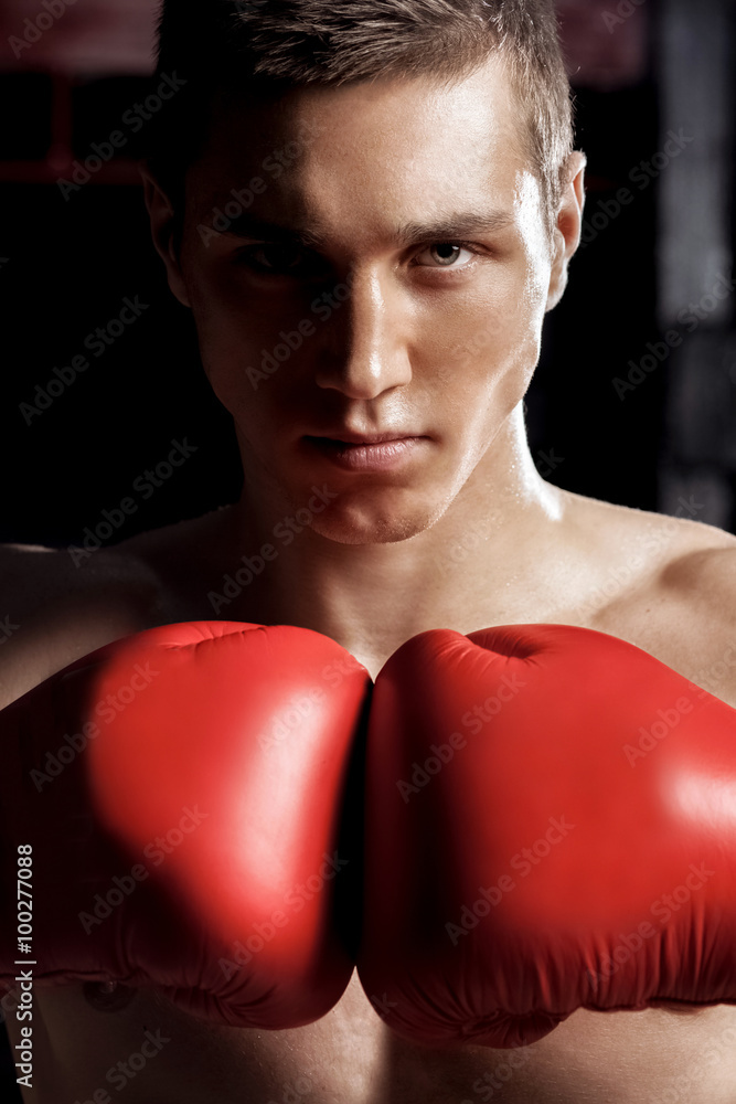 Cheerful male athlete is ready to fight Cheerful male athlete is ready to fight