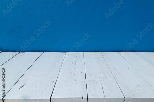 Blue wall and wooden floor interior background