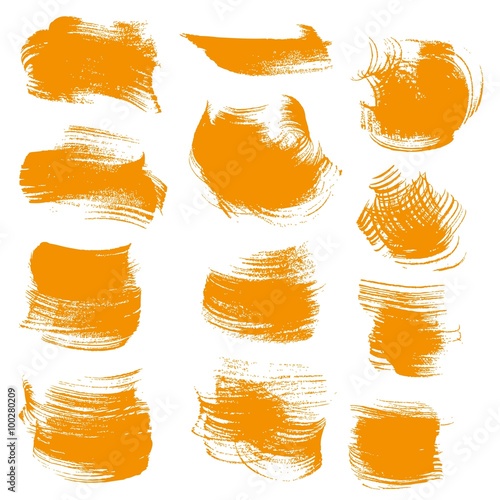 Abstract orange gouache smears isolated on a white background