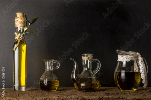  Extra virgin olive oil on rustic background