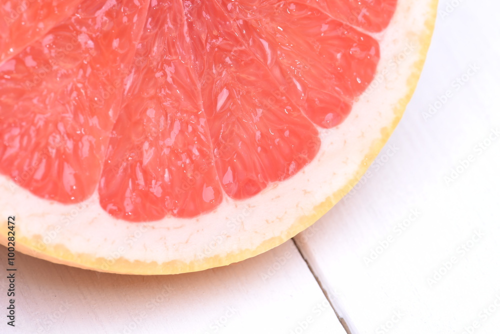 Red grapefruit on a wooden background