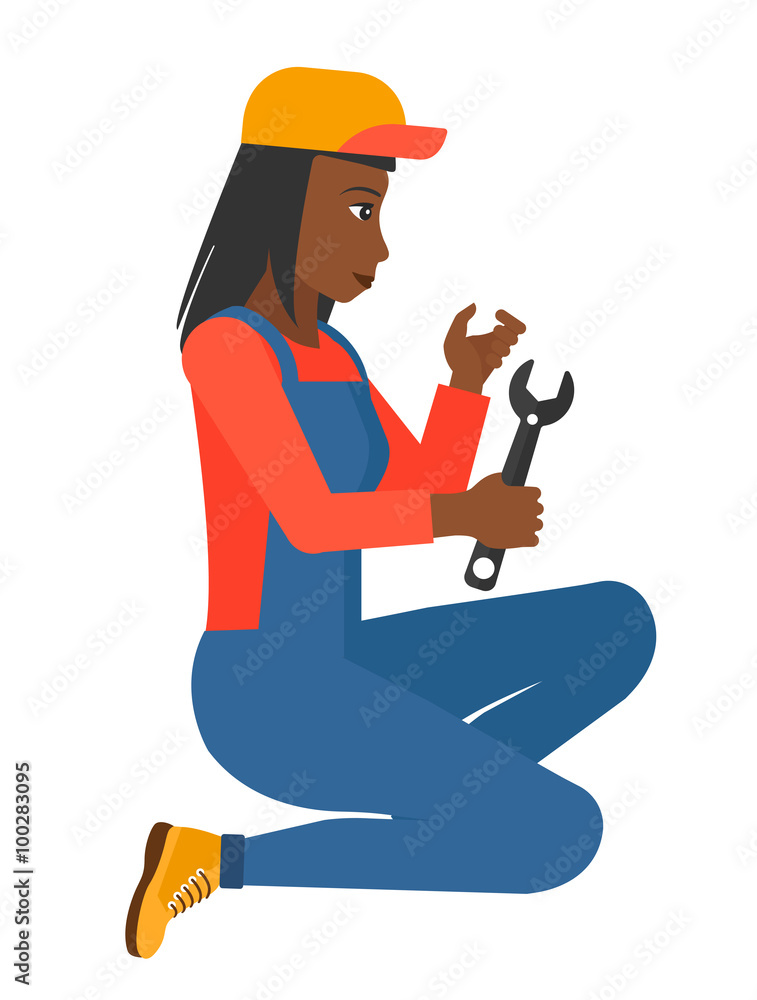 Repairer holding spanner. Repairer holding spanner.