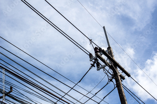 Electricity with a lot of wires under blue sky and clouds © Thapakorn