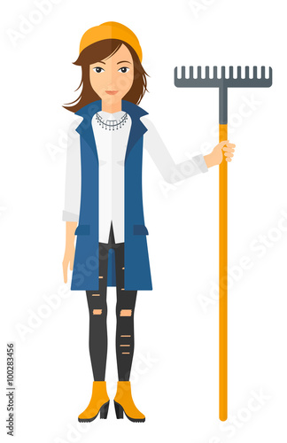 Woman standing with rake.