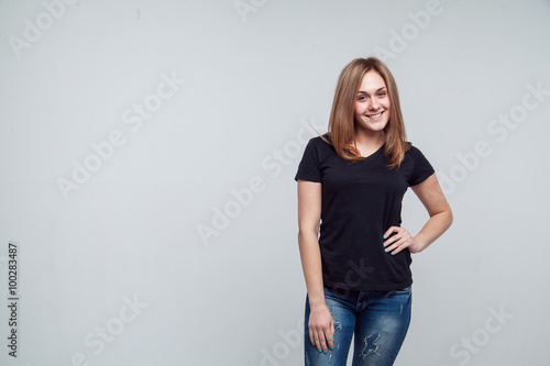 Young casual style woman portrait isolated over white background.