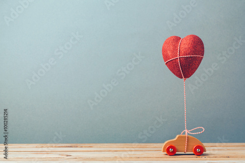 Valentine's day holiday celebration with toy car and heart shape