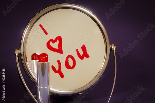 The inscription on the mirror written in lipstick