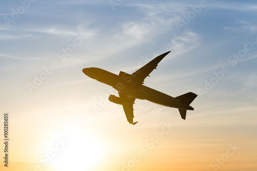 airplane silhouette on a sunset background
