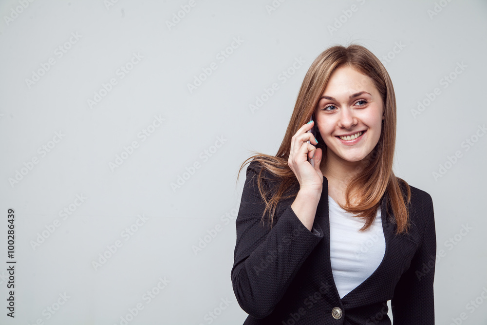 Beautiful smiling business woman talking on the phone Beautiful smiling business woman talking on the phone