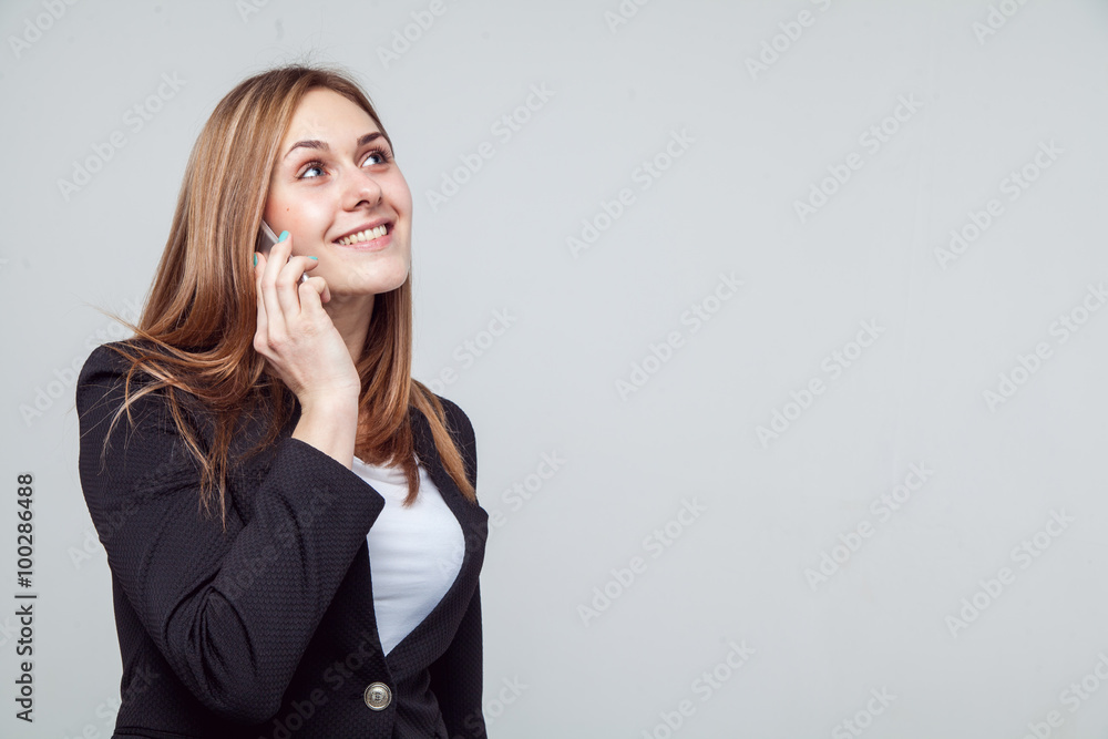Beautiful smiling business woman talking on the phone Beautiful smiling business woman talking on the phone