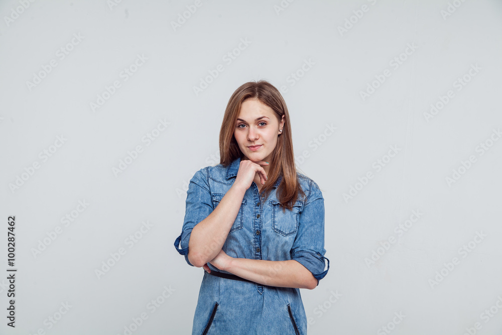 Portrait of a girl in a blue denim dress - isolated on white background Portrait of a girl in a blue denim dress - isolated on white background