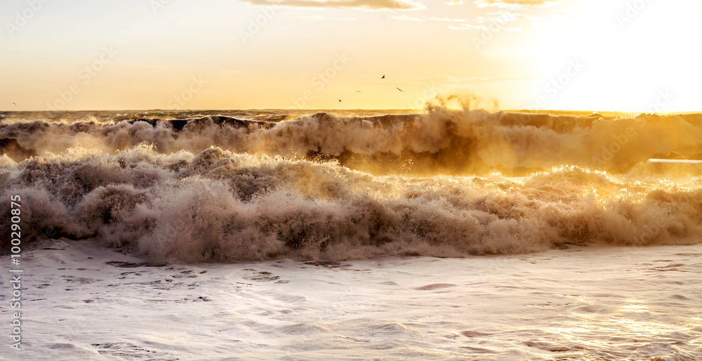 big waves at sunset
