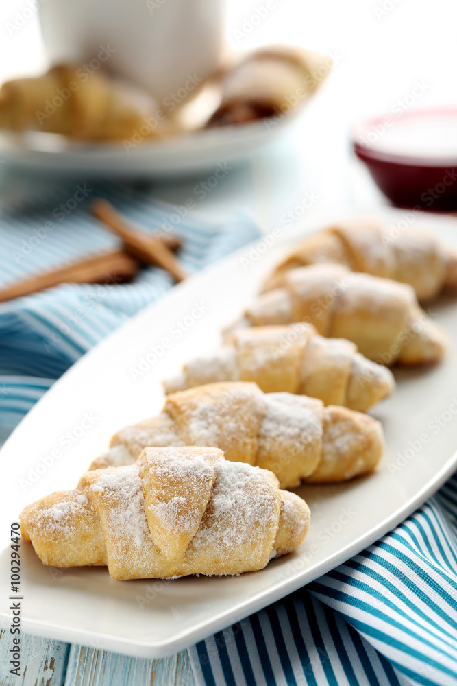 Fresh homemade croissants on a blue wooden table Fresh homemade croissants on a blue wooden table