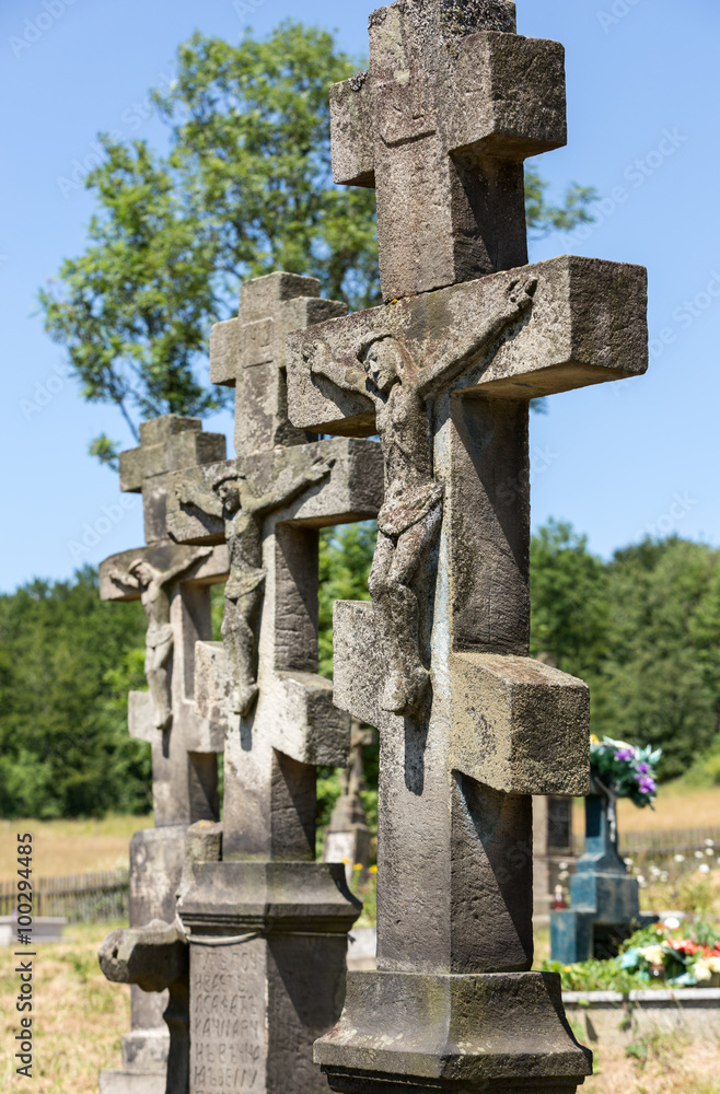 Old, abandoned stony Orthodox crosses