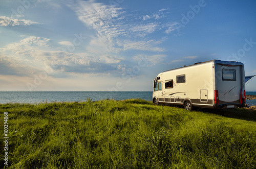 Recreational vehicle in a meadow photo