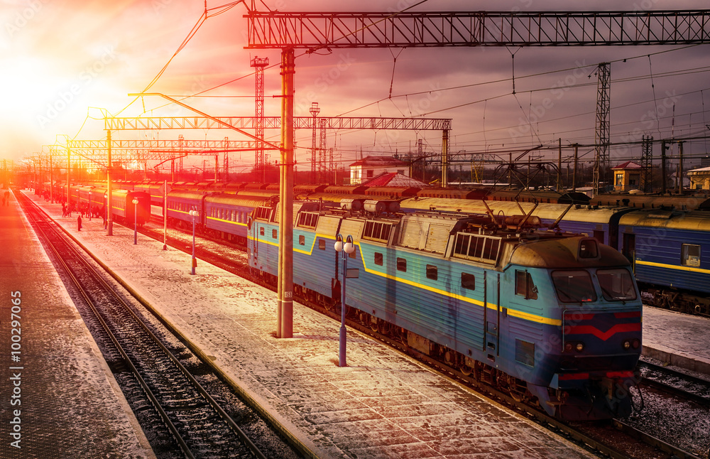train awaits passengers on peron in the rays of the sun train awaits passengers on peron in the rays of the sun