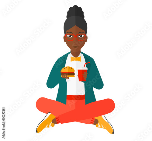 Woman eating hamburger. 