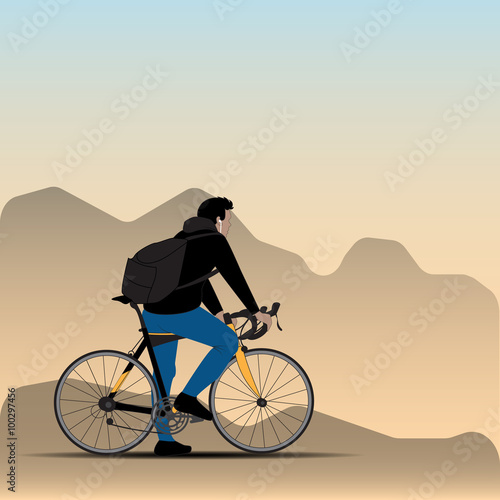 cyclist on the background of the blurry mountains