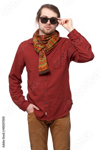 Man in a red shirt, bright scarf and sunglasses
