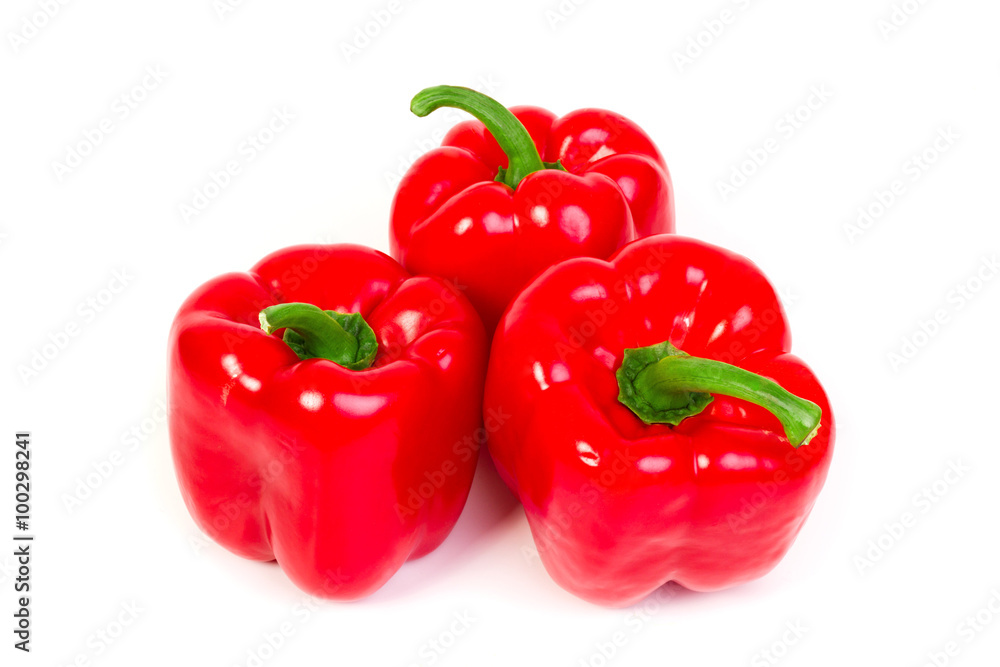 three sweet red peppers - isolated