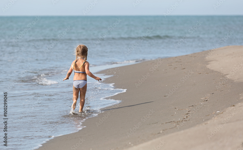 Girl runs along the beach Girl runs along the beach